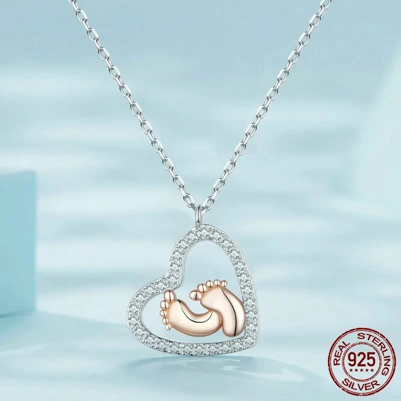 Two-tone Footprint Heart pendant necklace in sterling silver with elegant heart design