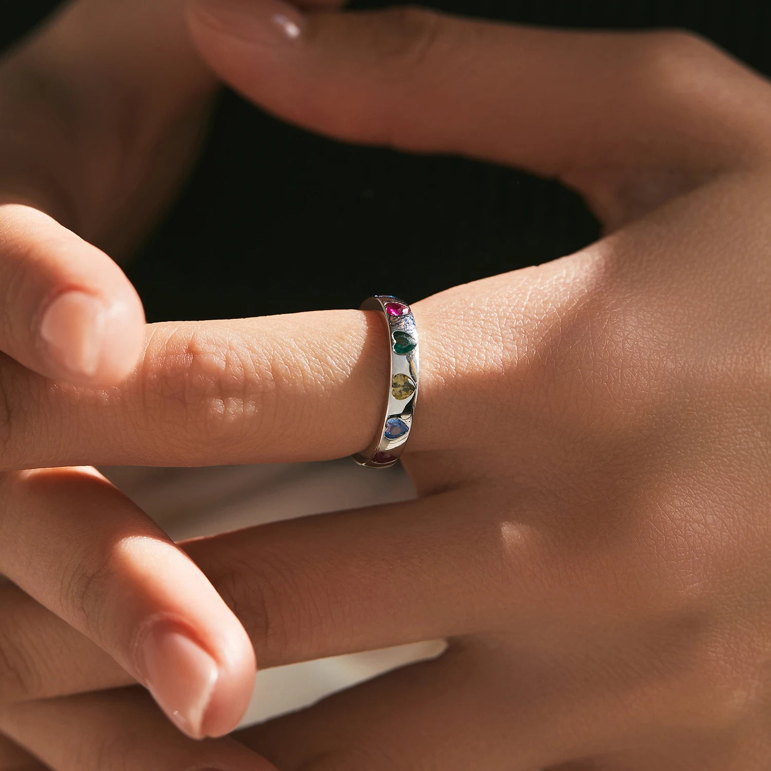 Woman wearing a Colorful Zircon Heart Ring in 925 sterling silver with multicoloured heart stones