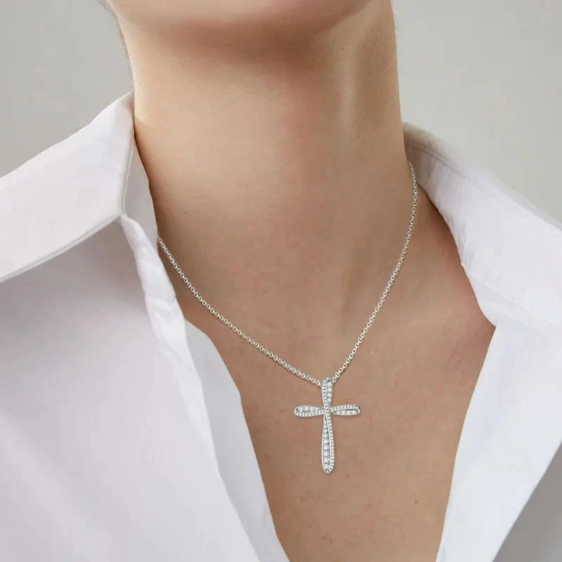 Woman wearing a Cross Pendant Moissanite Necklace in 925 sterling silver
