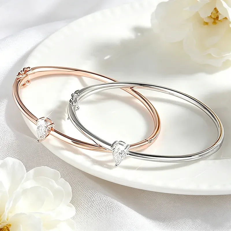 Close-up in two Moissanite Pear Cut Bangle 