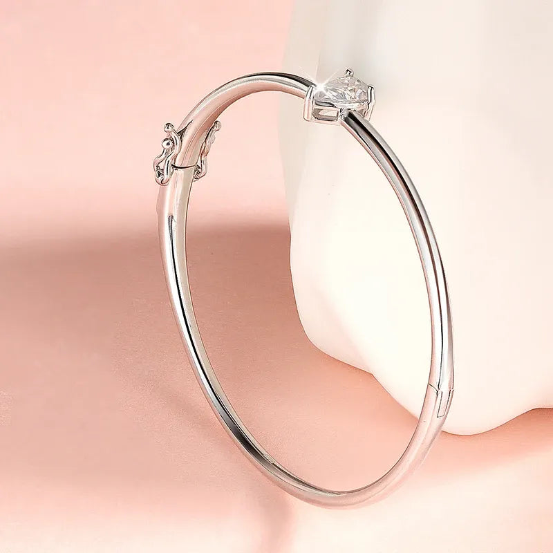 Moissanite Pear Cut Bangle with a brilliant certified pear cut moissanite gemstone.