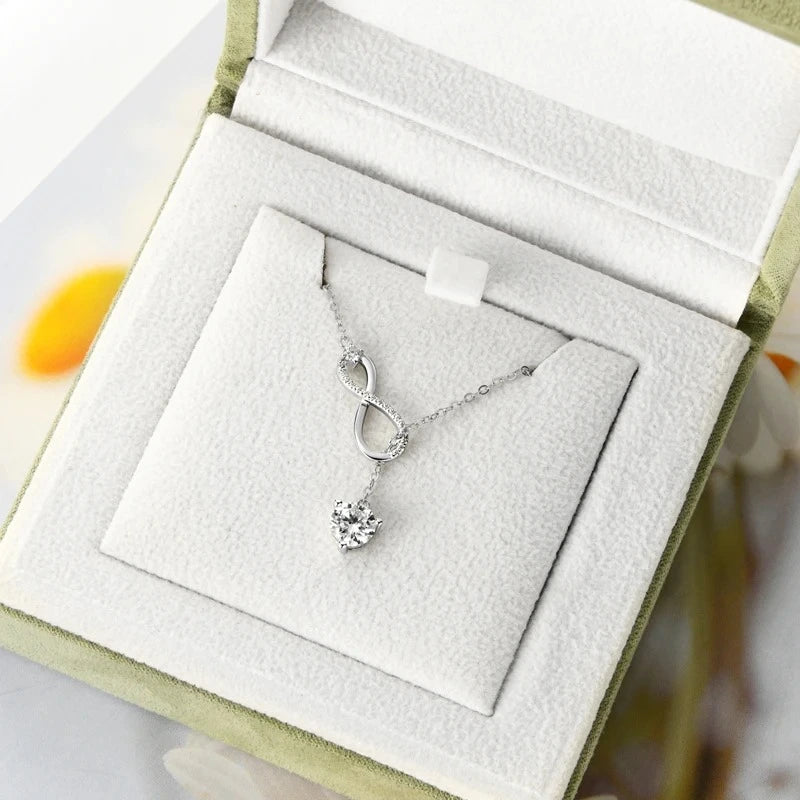 Detailed close-up of a brilliant 6.5 mm round moissanite in a three-prong setting