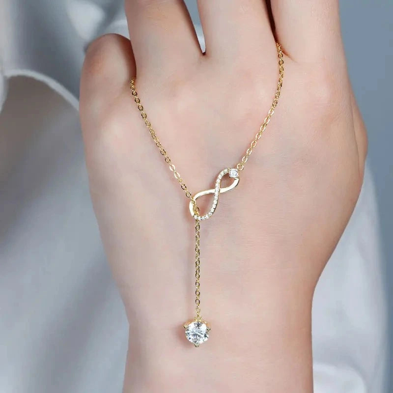 Infinity necklace crafted in 925 sterling silver with brilliant GRA certified moissanite and a floating solitaire pendant