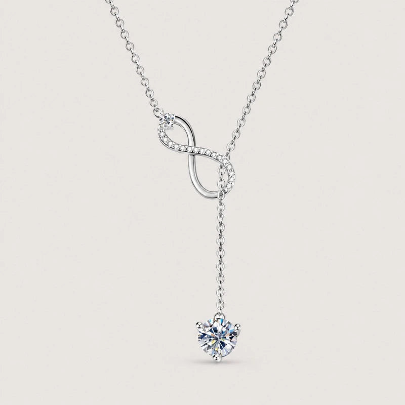 Silver colour sterling silver lariat necklace featuring a pavé infinity centrepiece