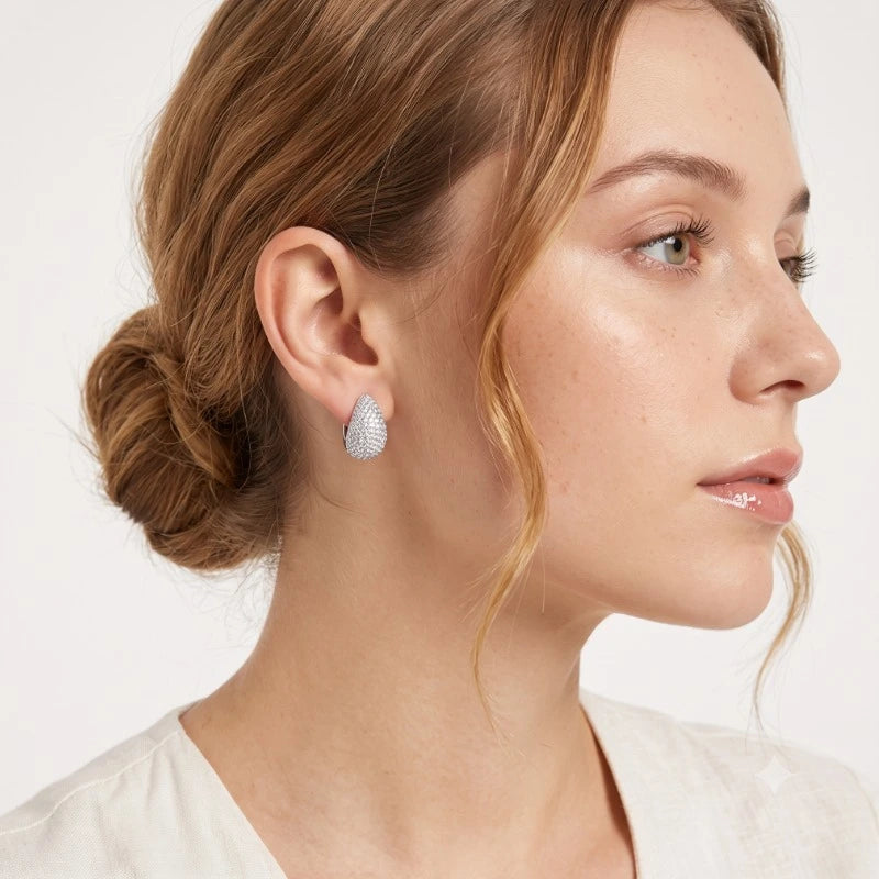 Woman wearing elegant Moissanite Hoop Earrings in 925 sterling silver