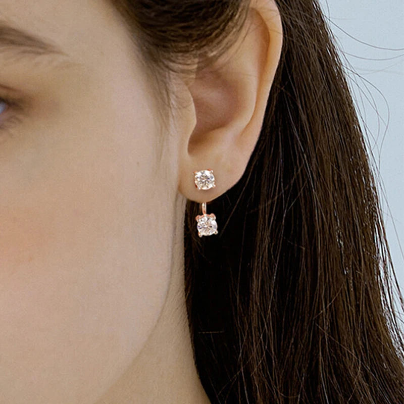 Woman wearing elegant Moissanite Stud Earrings crafted in genuine 925 sterling silver.