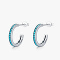 Close-up of Round Vintage Stud Earrings featuring natural turquoise stones set in genuine 925 sterling silver.