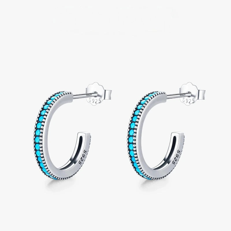 Close-up of Round Vintage Stud Earrings featuring natural turquoise stones set in genuine 925 sterling silver.