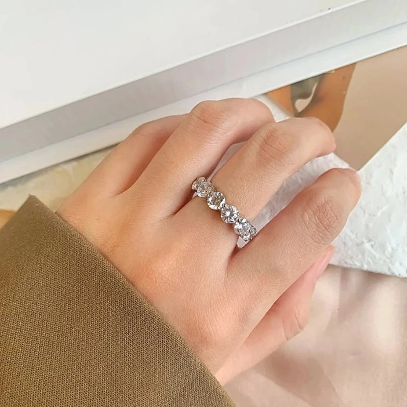 Woman wearing a sterling silver moissanite statement ring.