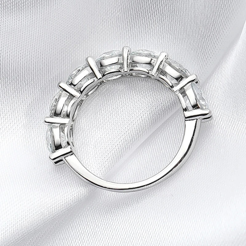 Side view of a women's sterling silver moissanite ring