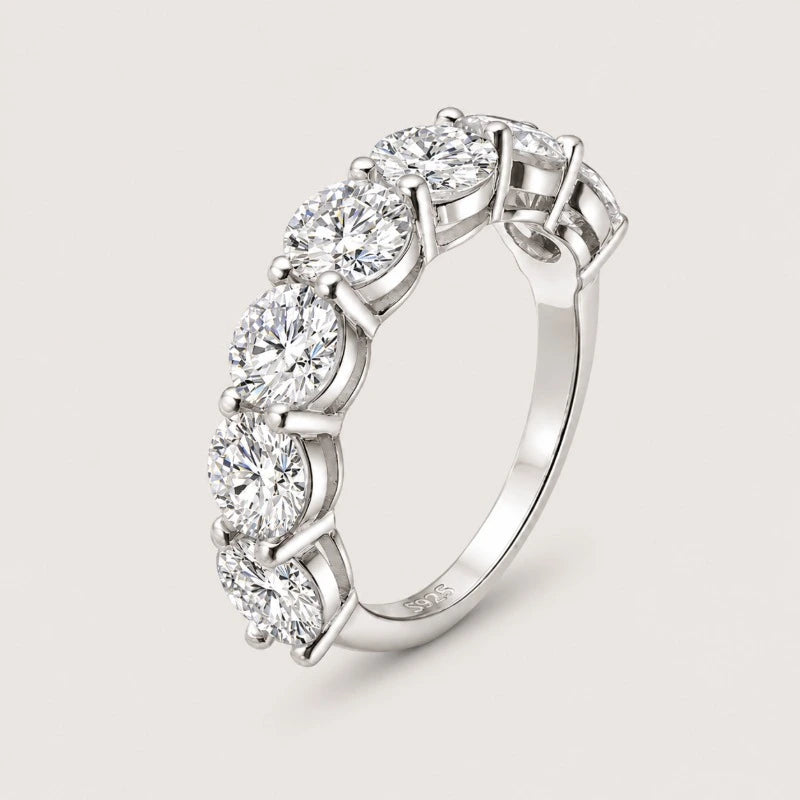 Women's sterling silver moissanite statement ring with pavé-set stones.