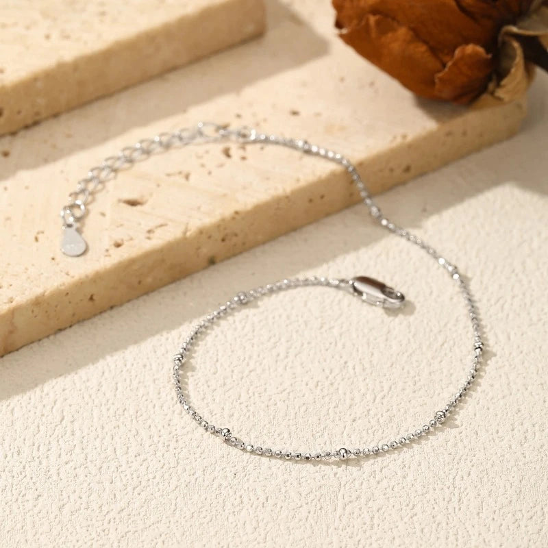 Close-up of the Silver Satellite Bead Bracelet featuring polished satellite beads 