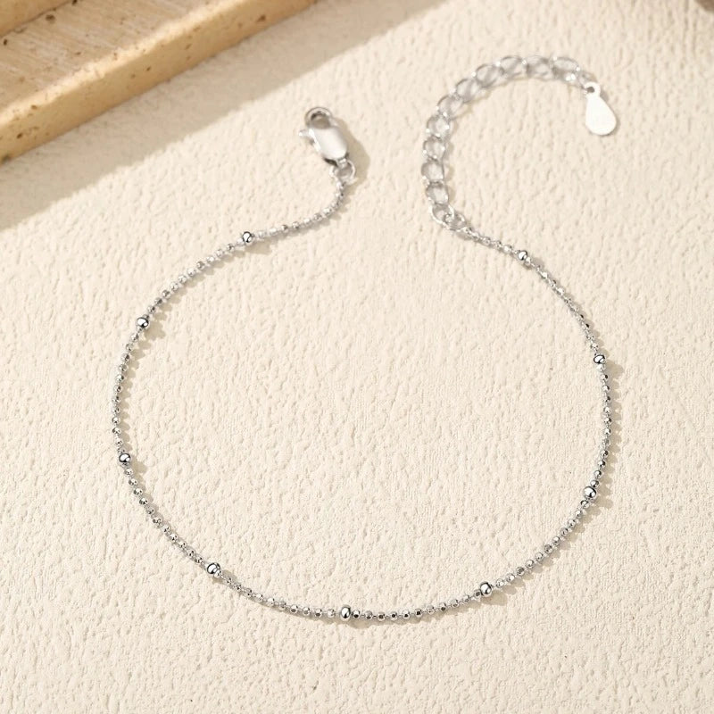 Close-up of the Silver Satellite Bead Bracelet featuring polished satellite beads on a fine 925 sterling silver chain.