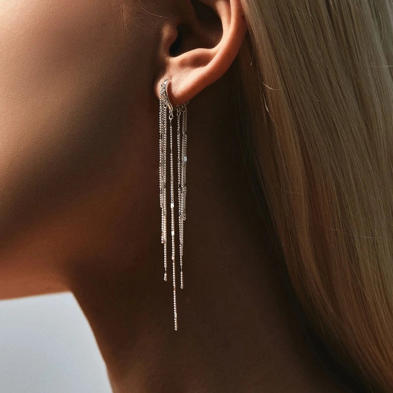 Woman wearing Silver Sparkling Long Tassel Hoop Earrings with elegant cascading sterling silver chains