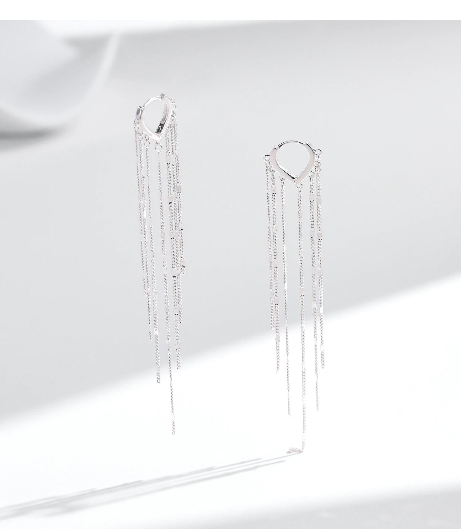 925 sterling silver long tassel hoop earrings with a 95 mm drop and reflective polished chain detailing