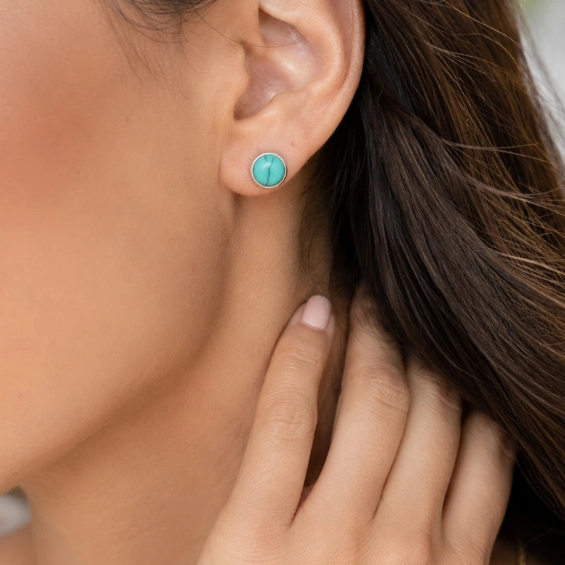 Woman wearing Sterling Silver Turquoise Earrings with small round turquoise stones 